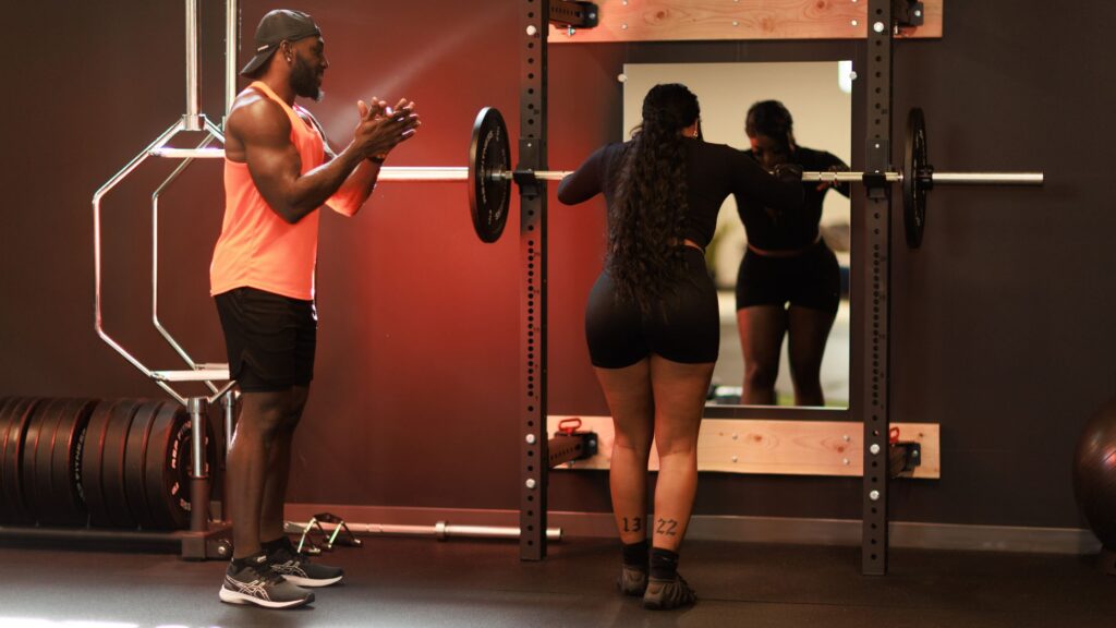Manuel Annang coaching a strength training session in Denver.