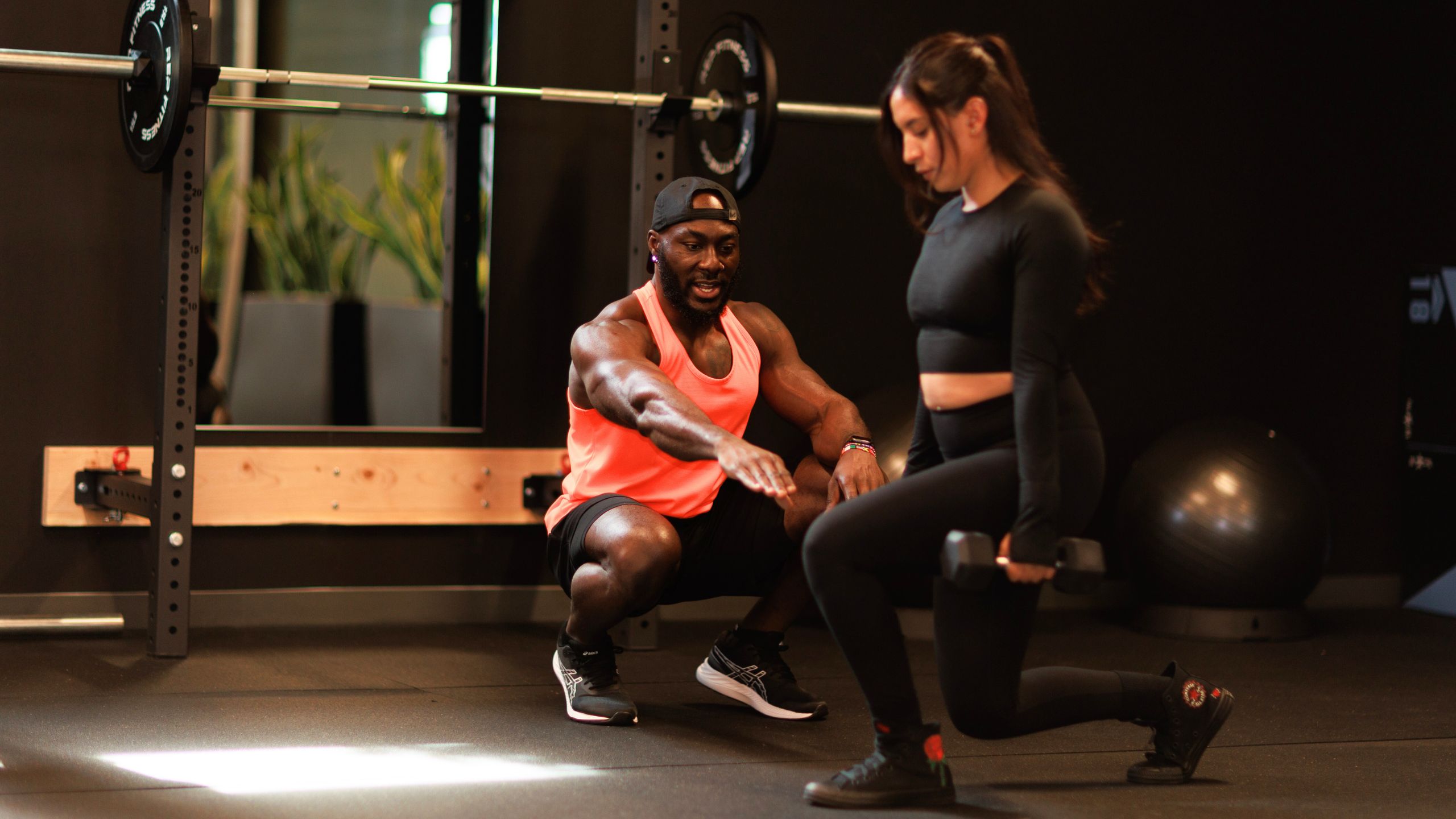 Denver personal trainer coaching a client through a strength training session.