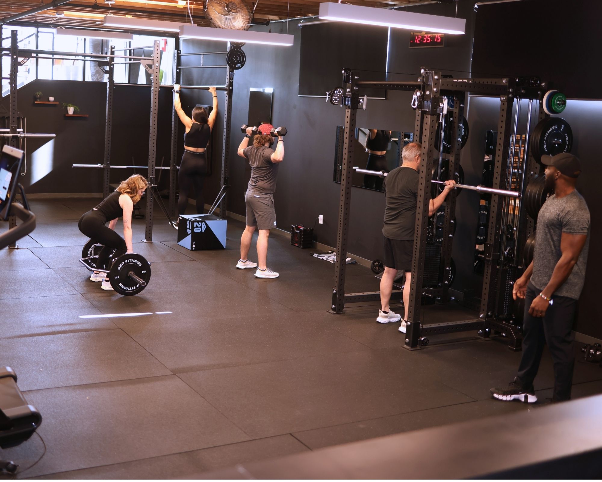 Small group fitness class in Denver studio for sculpt and tone.