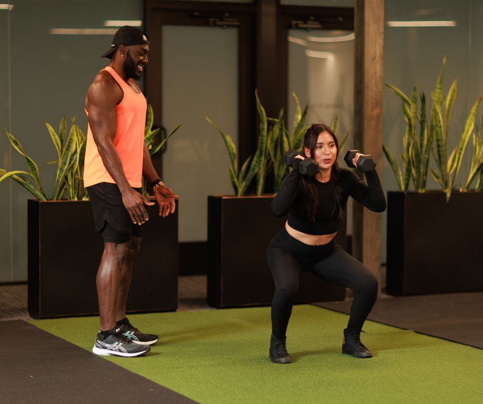 Private personal training session in Denver with client lifting weights.